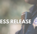 Words 'Press Release' in front of an officer's badge and radio