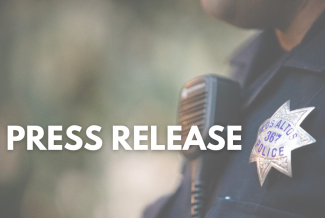 Words 'Press Release' in front of an officer's badge and radio