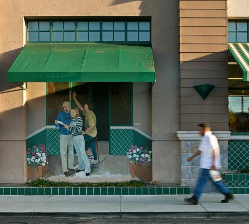 man walking down Los Altos street