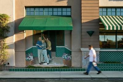 man walking down Los Altos street